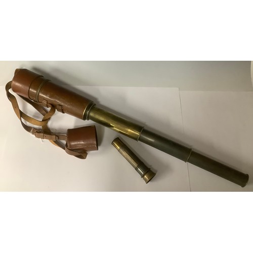 3040 - A brass four draw telescope, brown leather case with strap