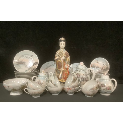 3062 - A Japanese Satsuma figure, of a Geisha, 38cm high, character marks to base; a Japanese eggshell tea ... 