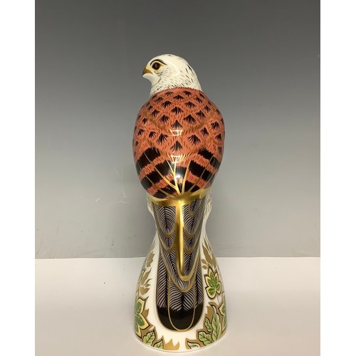 5098 - A Royal Crown Derby paperweight, Kestrel, gold stopper, 17cm, printed mark in red