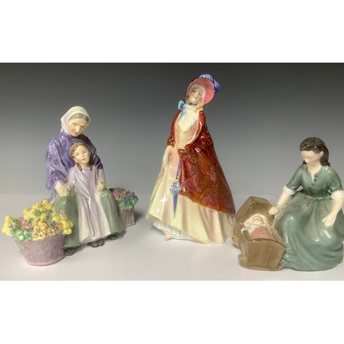 3163 - A Royal Doulton figure group, Cradle Song, HN2246; another, Granny's Heritage, HN2031; a Royal Doult... 