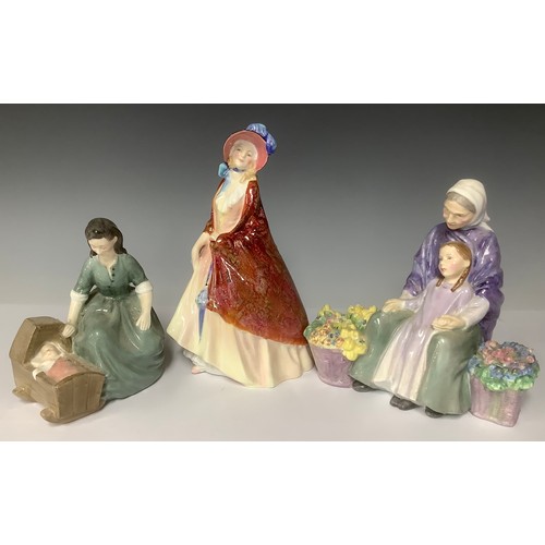 3163 - A Royal Doulton figure group, Cradle Song, HN2246; another, Granny's Heritage, HN2031; a Royal Doult... 