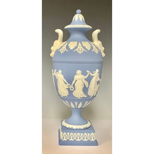 3171 - A Wedgwood Jasperware two-handled pedestal urn and cover, the handles with Bacchic mask terminals, t... 