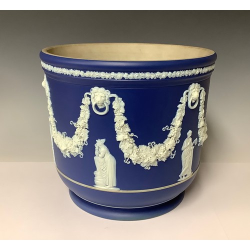 3175 - A large Wedgwood Jasperware jardinière, typically sprigged in white on a cobalt blue ground, applied... 