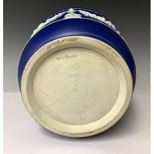 3175 - A large Wedgwood Jasperware jardinière, typically sprigged in white on a cobalt blue ground, applied... 