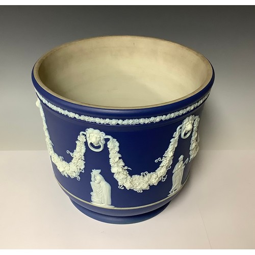 3175 - A large Wedgwood Jasperware jardinière, typically sprigged in white on a cobalt blue ground, applied... 