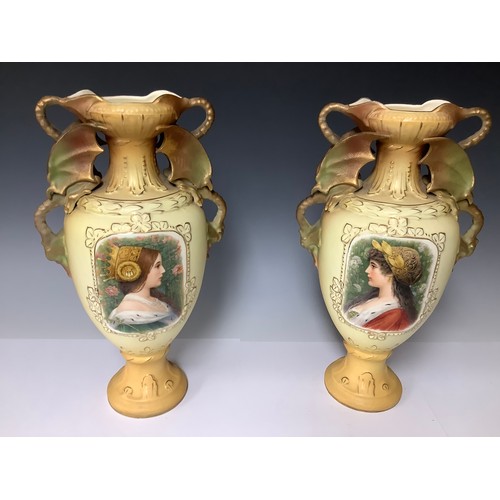 3218 - A large pair of Austrian Royal Wettina ovoid pedestal vases, each with a pair of dragon loop handles... 