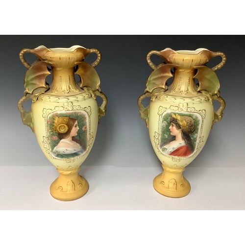 3218 - A large pair of Austrian Royal Wettina ovoid pedestal vases, each with a pair of dragon loop handles... 