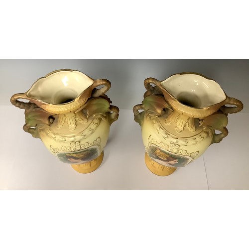 3218 - A large pair of Austrian Royal Wettina ovoid pedestal vases, each with a pair of dragon loop handles... 