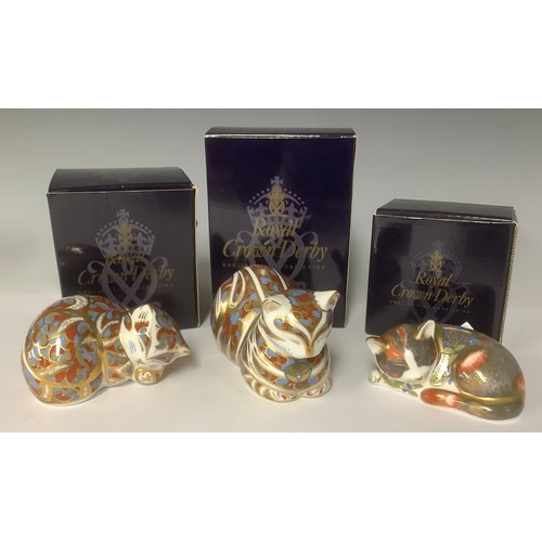 3221 - A pair of Royal Crown Derby paperweights, Contented cat and Contented Kitted, gold stoppers, printed... 