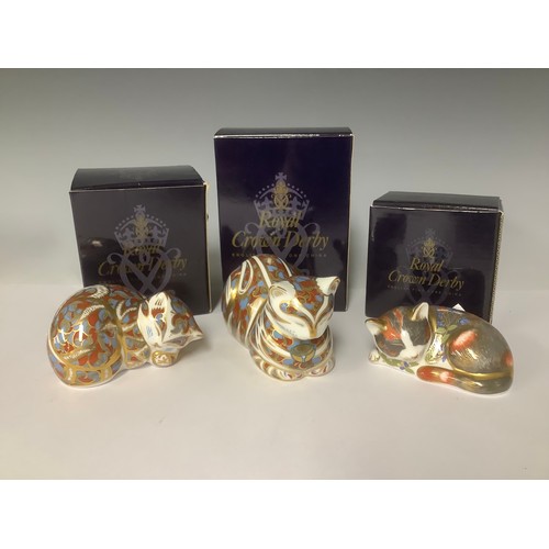 3221 - A pair of Royal Crown Derby paperweights, Contented cat and Contented Kitted, gold stoppers, printed... 