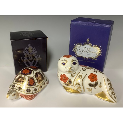 3225 - A Royal Crown Derby paperweight, Tortoise, printed in the 1128 pattern, gold stopper, 12cm long, box... 