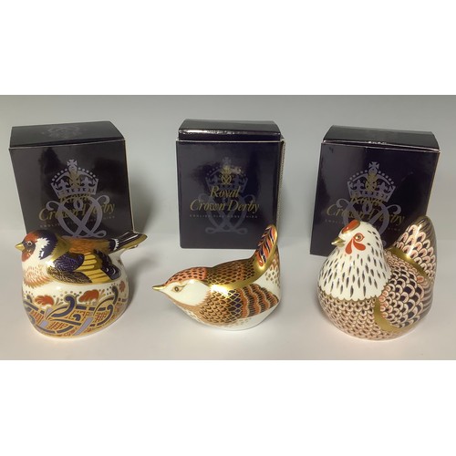 3228 - A Royal Crown Derby paperweight, Goldfinch Nesting, gold stopper, 6cm, printed mark, boxed; two othe... 