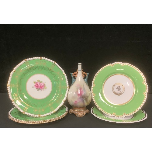 3233 - A pair of Royal Worcester Armorial shaped circular plates,  the centre with the crest of lion rampan... 