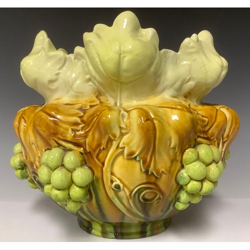 3237 - A Bretby Art Pottery jardinière, moulded in high relief with a continuous band of fruiting vine, num... 