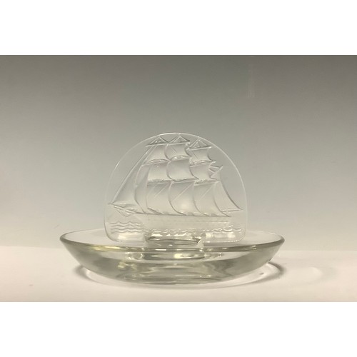 3246 - A Lalique Tall Ships pattern ring tray, applied with a frosted glass galleon motif, 10cm diameter, e... 