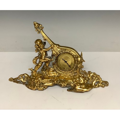 3280 - Clocks - a Victorian ormolu brass clock, musical putto, gilt face, Arabic numerals, modern movement,... 