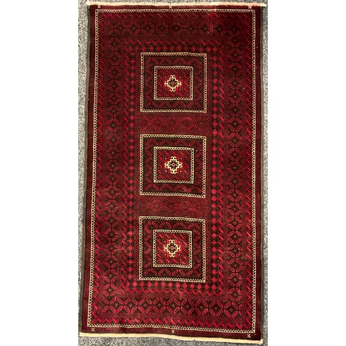 3296 - Middle East and the Orient - a Pakistan design Balouch type wool rug or carpet, 204cm x 109cm