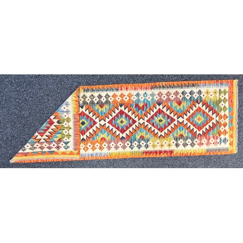 3305 - Rugs and Carpets - a Chobi kilim carpet runner, 207cm x 66cm