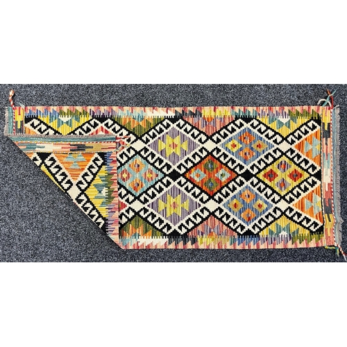 3306 - Rugs and Carpets - a Chobi kilim carpet runner, 154cm x 66cm