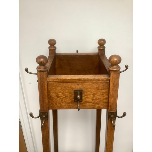 3309 - An oak Arts and Crafts hall stand, 177cm high