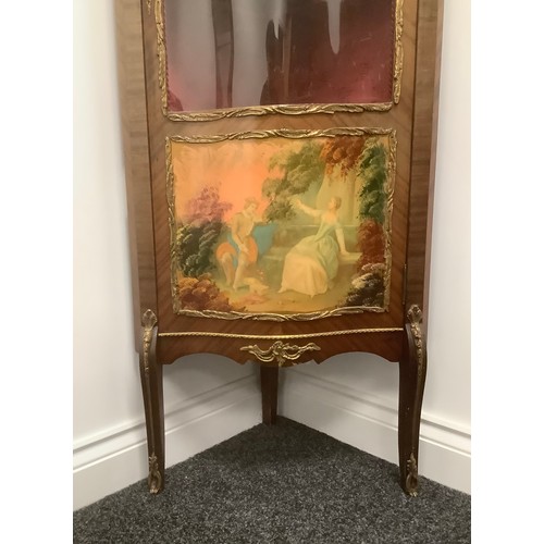 3310 - A Louis XV style gilt metal mounted mahogany serpentine corner vitrine, three-quarter glazed door ap... 