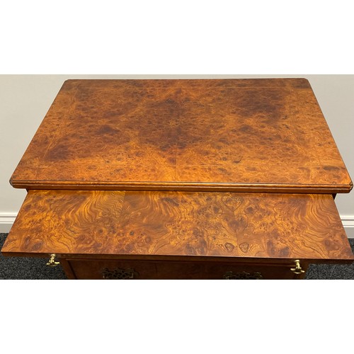 3311 - A George I style amboyna bachelors chest, quarter veneered top outline with boxwood stringing, the m... 