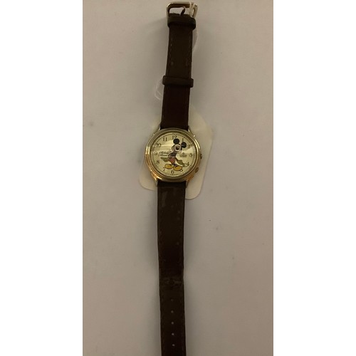 3345 - Watches - a Lorus Mickey Mouse melody alarm wristwatch, golden face decorated with Mickey Mouse figu... 