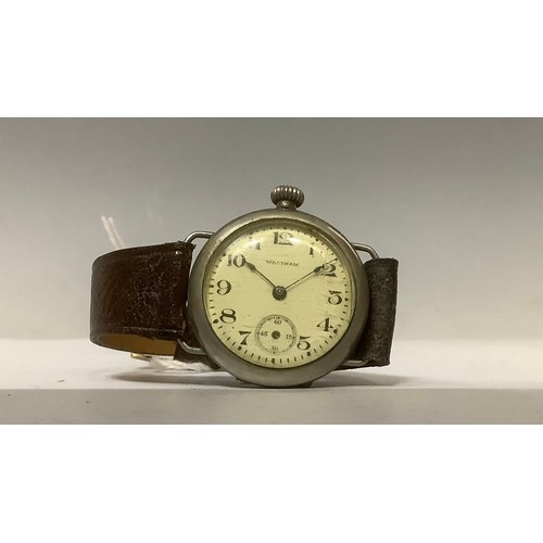 3346 - Watches - a WWI A.W.W. Co. Waltham Mass. trench wristwatch, ivory coloured face, Arabic numerals, se... 