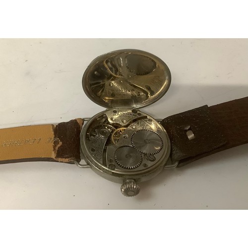 3346 - Watches - a WWI A.W.W. Co. Waltham Mass. trench wristwatch, ivory coloured face, Arabic numerals, se... 