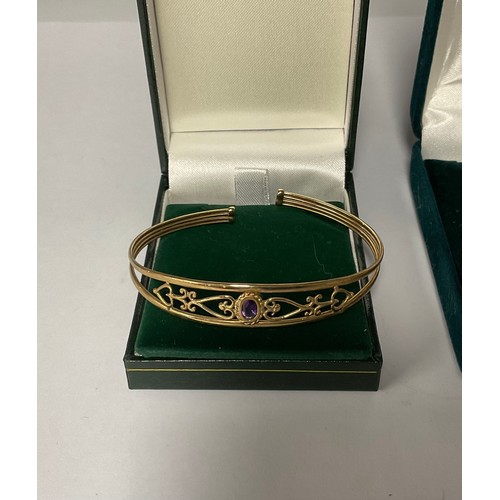 3361 - A 9ct gold openwork bangle, set with a single facetted oval amethyst, marked 375, 4.9g, boxed; a 9ct... 