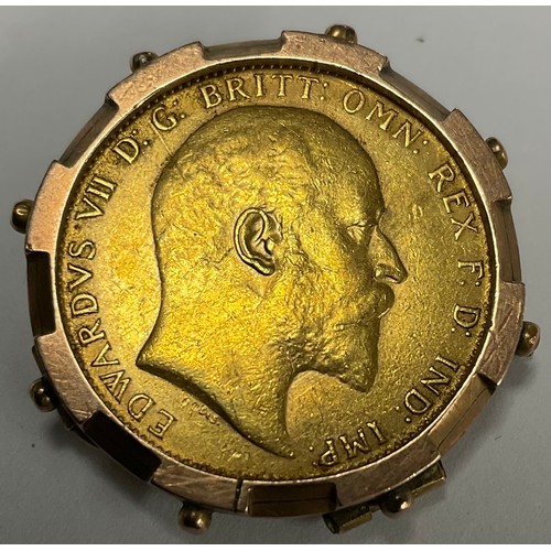 3382 - An Edward VII gold full sovereign, 1910, metal mounted as a pendant/brooch, 10.4g gross