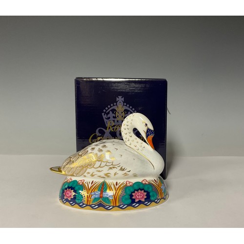 3015 - A Royal Crown Derby Paperweight, White Swan Nesting, gold stopper, 14cm long, printed mark, boxed