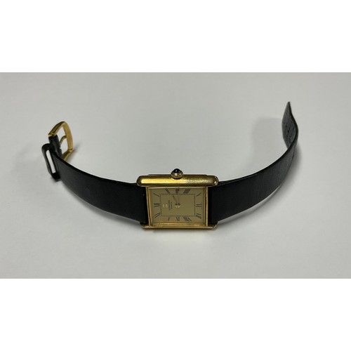 3390 - A lady's Sarcar Geneve gold plated watch, rectangular Champagne dial, Roman numerals, the winder set... 