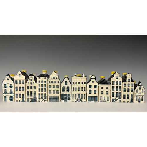 3026 - Ceramics - a KLM Delft Blue miniature house Bol gin decanter, 11cm high; others similar (12)