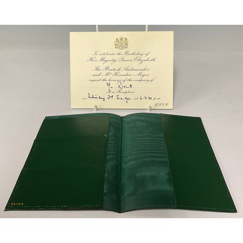 3394 - A Rolex green leather passport holder, the cover embossed with a crown logo in gold, fitted green sa... 