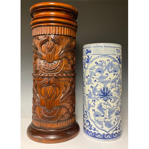 3278A - A reproduction cylindrical walking stick and umbrella stand, carved with leafy scrolls, stop fluted ... 