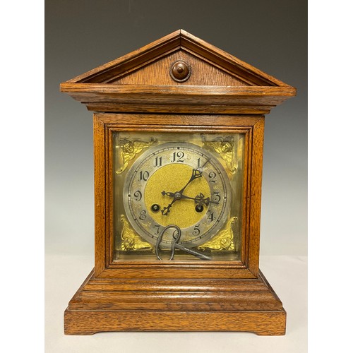 3241A - An Edwardian Oak mantle clock, square brass dial, silvered chapter ring, Arabic numerals, striking o... 