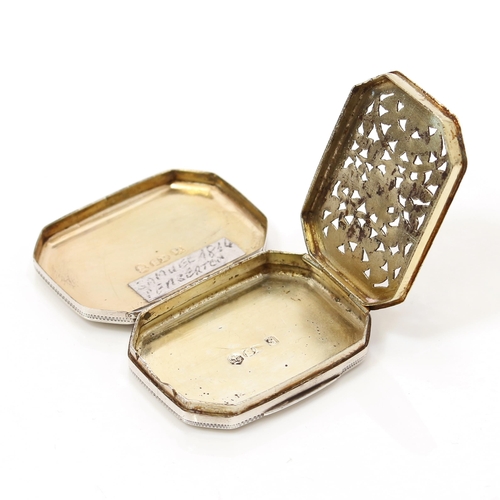 67 - A George III silver lozenge shaped vinaigrette, hinged cover enclosing a gilt interior with pierced ... 