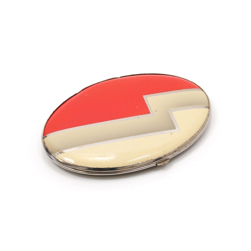 171 - An 'Art Deco' style oval shaped powder compact, by Gwenda, the hinged lid decorated with a bold geom... 