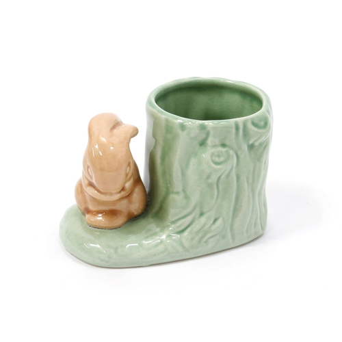 201 - A Hornsea pottery spill vase, of small proportions, in the form of a rabbit beside a tree stump, 6.5... 