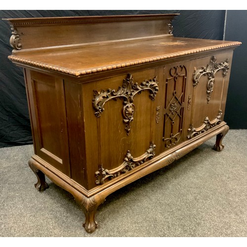 60 - A Gothic style oak Buffet sideboard, quarter-galleried over-sailing top with gadrooned edge, over a ... 