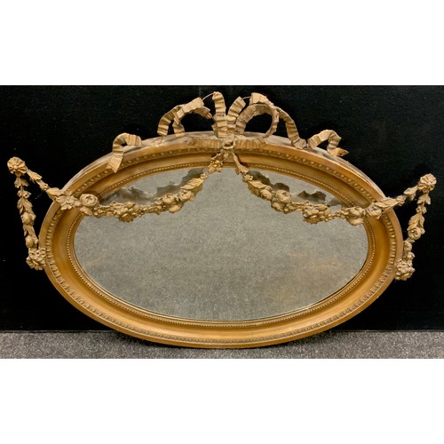 64 - A 19th century French oval gesso and gilt wooden wall mirror, ribbon bow and floral swags detailing,... 