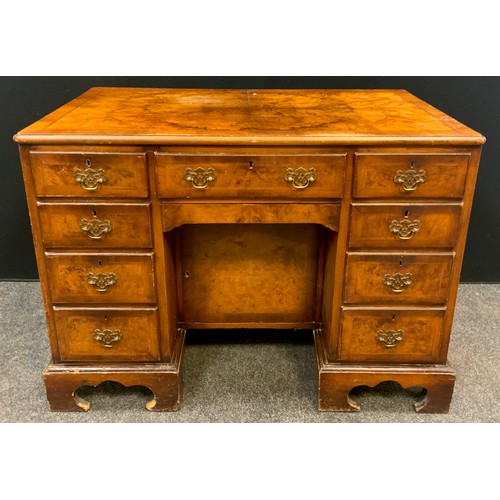 82 - A George II style walnut and Burr walnut knee-hole desk, single drawer to frieze, above a ‘secret’ d... 