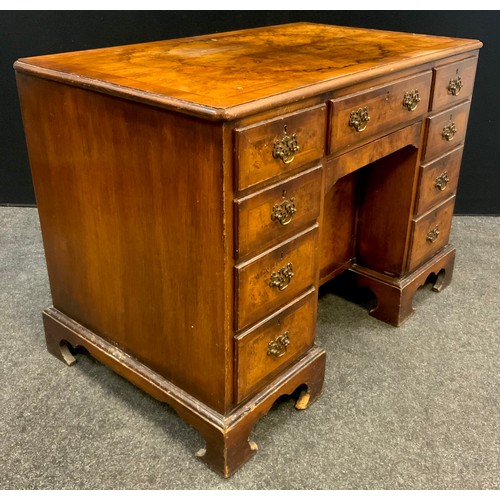 82 - A George II style walnut and Burr walnut knee-hole desk, single drawer to frieze, above a ‘secret’ d... 