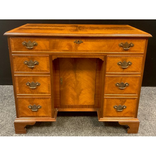 86 - A George II style walnut knee-hole desk, 76cm high x 92.5cm wide x 49.5cm deep, 20th century.