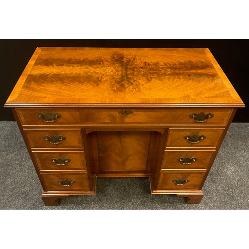 86 - A George II style walnut knee-hole desk, 76cm high x 92.5cm wide x 49.5cm deep, 20th century.