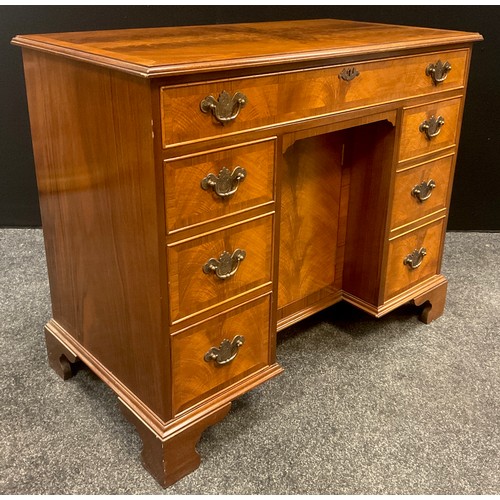 86 - A George II style walnut knee-hole desk, 76cm high x 92.5cm wide x 49.5cm deep, 20th century.