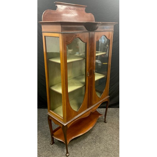 68 - An Edwardian mahogany Vitrine or china display cabinet, shaped quarter-galleried back, break-centre ... 