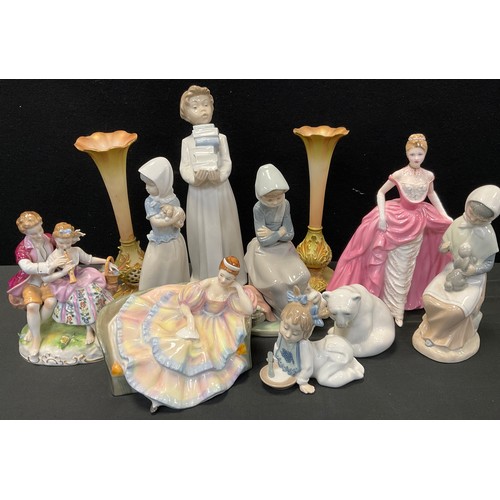 96 - A group of figures including Nao girl with pup,22cm high, woman with geese, 20cm high, three others;... 