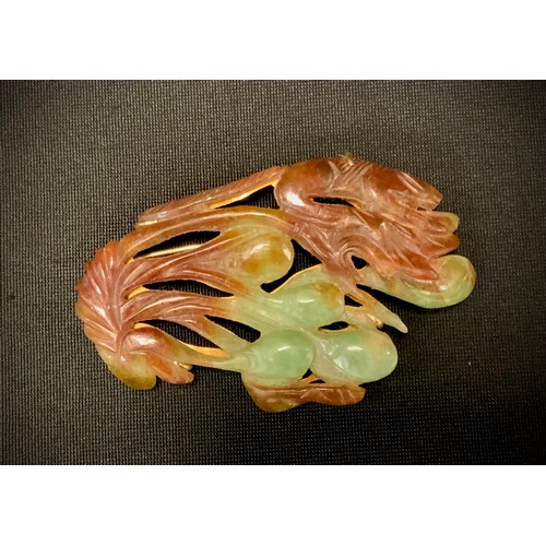 287 - A Chinese carved hardstone and jade table brooch, as a cluster of Animals and Foliage, in tones of b... 